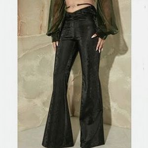 Black snakeskin-pattern flared pants. Stretchy